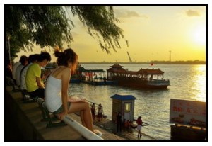 Ferries tie up on the Songhua River with gondolas in the background to Sun Island.